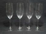 Quatro flutes para champagne em vidro translúcido acondicionados em embalagem original da manufatura LUMINARC. Alt. 23cm.