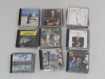 Cinquenta CD's de diversos artistas e temas variados.