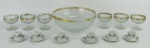 a) Seis xícaras para café em porcelana com marca da manufatura Polovi no verso, decoradas com flores e folhas em policromia. Detalhes em dourado. Alts. 4 cm.b) Conjunto de bowl e 6 taças para sobremesa em demi cristal translúcido, decorados com lapidações bico de jaca e em sulcos. Detalhes em dourado com desgastes. Med. bowl 10x25 cm. Alt. taças 8 cm.