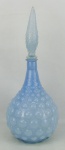 Garrafa em vidro anos 50 no tom azul, decorada com trabalhos de bolas em relevo. Alt. 45,5cm.