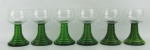 Seis taças na tonalidade verde e translucida em cristal, com trabalhos em gomos. Alt. 12,5 cm.