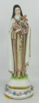Santa Teresinha - Imagem em porcelana policromada e com detalhes em dourado. Alt. 29,5cm.
