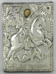 São Jorge - Antigo ícone de coleção em prata contrastada, possivelmente russa, com trabalhos em relevo. Med. 12,5x9,5 cm.