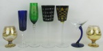 Sete taças de diversas procedências e decorações, cores e tamanhos. Alt. maior e menor 26 e 12 cm.