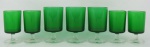 Vinte e três taças de dois tamanhos diferentes, em vidro francês, no tom verde e translúcido. Localizados France em relevo na base. Alts. 11,5 e 10,5cm.