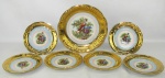 Conjunto dos anos 60, composto por prato para bolo e 6 pratinhos em porcelana com marca da manufatura DP no verso. Abas no tom dourado e ao centro paisagem com casal em policromia. Minúsculos desgastes na policromia. DIams. 25,5cm e 18cm (6x).