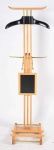 Cabideiro estilo art-deco em madeira entalhada e bronze, modelo criado em 1930, pelo renomado designer e decorador francês Paul Dupre - Lafon. A peça apresenta um suporte para terno, bandeja para relógio e abotoaduras, e sapateira. Ganchos e hastes em bronze para gravatas, cintos e suspensórios. Alt. 136,5cm.