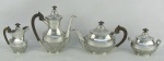 Serviço para chá e café em prata portuguesa, contraste Águia, teor 833 milésimos e marcado Mergulhão Joalheiro Lisboa na base, composto de 2 bules, leiteira e açucareiro, decorados com trabalhos de gomos em relevo. Pegas das tampas e alças em madeira. Tampa do açucareiro com pequena mossa. Alt. bule maior 21,5cm. Peso total 2.060g.