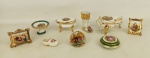 Nove miniaturas de coleção em porcelana francesa de Limoges, de diversas formas e decorações. Med. maior 3,5x9,5x6,5cm.
