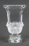 Vaso em cristal alemão translúcido, com etiqueta da Cristallerie na base. Decorado com lapidações de folhagens em relevo. Al. 25cm.
