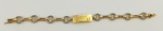 Pulseira em ouro 18k, branco e amarelo, em elos e com placa contendo 1 brilhante e gravado Mario. Comp. aberto 18cm. Peso 29.4g. Este ítem não se encontra no local do leilão.
