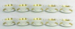 Dez taças para consome com presentoir em porcelana, com marca da manufatura na base, decorados com ricos detalhes em dourado. Alt. taças 7cm.