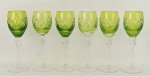 Seis taças em cristal, no tom doublet verde e translúcido, lapidado em frisos bisotados formando losangos e X. Alt. 16,5cm.