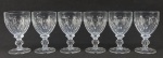 Lisa Mori - Seis taças em grosso cristal austríaco, profusamente lapidados com dedão, olivas, frisos e gomos. Marca da designer na base. Alt. 15,5cm.
