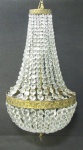 Lustre na forma de pera, para 5 luzes, em cristal com contas bisotadas. Guarnições em bronze trabalhado. Alt. 70cm.