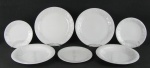 Quarenta e oito pratos em porcelana, com marca da manufatura no verso, decorados nas abas com cachos de uvas e parreiras, em relevo, sendo 12 rasos, 12 fundos 12 para sobremesa e 12 para pão. Diam. maior 25,5cm.