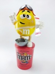 M&M - Dispenser do Chocolate M&m´s com tema de Aviador, acompanha base, medindo 21 cm de altura, obs: Está vazio