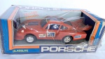 Brinquedo antigo GLASSLITE - Lindo Porsche Martini Racing. Embalagem parcialmente lacrada - Funcionando a fricção. A caixa mede 26cm de comprimento. Brinquedo da década de 80.