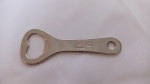 Abridor de garrafa promocional da empresa Coca Cola. Mede 10,5cm de comprimento