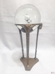 Bola decorativa em vidro com bolhas internas e pé em bronze trabalhado. Medindo 24cm de altura total e a bola 9,5cm de diâmetro.