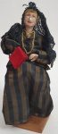 Antiga boneca filipina, feita em plástico rígido, massa, tecido e enchimento, med. 21 centímetros.