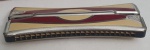 Bela gaita dupla da marca GHF, feita em latão em bom estado. Med. 3 x 18 x 7 centímetros.