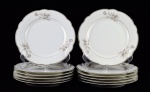 LUIGI BELTRAMI - Doze elegantes pratos de sobremesa de porcelana, tendo ao fundo  a marca do distribuidor  Luigi Beltrami - via venti settembre, 58 - Torino.  Decoração padrão floral. Contornos em prata.  Med. 22 cm de diâmetro. Marcas de uso. Faltas . Presença de um lascado da parte de baixo em um dos pratos e  pedaço colado na borda do outro. Coleção Particular de origem Italiana.