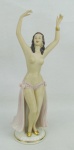 A. Steiner - Escultura art-deco, de coleção, em porcelana europeia, policromada, representando "Dançarina "Semi-desnuda". Assinado na base. Alt. 24 cm.