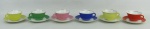 Seis xícaras para café, anos 60, em porcelana, com marca da manufatura Maria, de diversas cores.