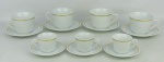 Vinte e quatro xícaras, anos 60, em porcelana Steatita, na cor branca com frisos em dourado, sendo 12 para café e 12 para chá.