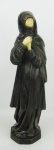 Rara e antiga escultura em pedra sabão, patinada com mãos e rosto em material sintético, representando "Anum". Alt. 39,5 cm.