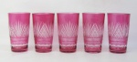 Cinco copos em cristal na tonalidade doublet rosa, com lapidações dedão e sulcos bisotados. Alt 22,5 cm.