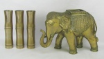 Quatro peças em bronze dourado, sendo floreira, representando elefante e 3 solifleurs na forma de bambus. Med. elefante 24x35x16 cm. Alt. solifleurs 23,5 cm.