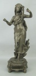Assinatura Ilegível - escultura em pewter, pintado de prateado, representando "Jovem com flores". Marcas do tempo na pintura e perda no galho com flores. Alt. 24cm.