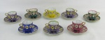 Oito xícaras de coleção em porcelana japonesa, de diversas cores, decoradas com figura feminina em policromia e ricos detalhes em dourado. Alt. xícara 5cm.