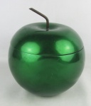 Geleira art-deco de coleção, dos anos 50, em metal no tom verde, na forma de maça. Parte interna em vidro opalinado no tom leitoso. Alt. 23cm.
