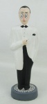 Escultura em gesso policromado, representando "Amigo da onça". Alt. 21cm.