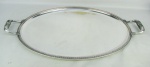 Christofle - bandeja com alças em metal francês, espessurado a prata, com marca da manufatura no verso. decorado com folhas, flores e perolados em relevo. Desgastes, perdas no prateado e com mossas. Med. 4x64,5x42cm.