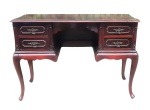 Mesa secretária estilo Chipandele em madeira entalhada, com 2 gavetas de cada lado. Puxadores em bronze. Marcas de uso. Med. 77x113x46cm.