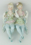 Grupo escultórico em biscuit europeu policromado, representado "Trapezistas". Med. 15x11x7cm.