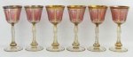 Seis belas e raras taças em cristal na tonalidade rosa e translucida. Lapidações de sulcos e facetados. Ricos detalhes em dourado. Alt. 19cm.
