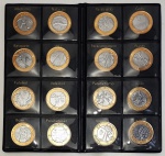 Numismática - Álbum completo com 17 moedas de 1 real, comemorativas das Olimpíadas Rio 2016, bimetálicas (aço inox no núcleo e anel em aço revestido de bronze), sendo 14 de modalidades esportivas diversas, 2 de mascotes (Vinicius e Tom) e 1 da bandeira olímpica. Estado de conservação Flor de Cunho (nunca circuladas e retiradas diretamente do sachê distribuído pela Casa da Moeda).