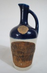 BEBIDAS - Uma (1)  garrafa em porcelana de Curação Orange Dolfi  Sec.,conteúdo 700 ml, lacrada.