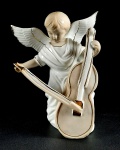 Escultura em porcelana anjo musicista na cor branca com detalhes em dourado. Medidas aproximadas 17 cm e largura 16 cm
