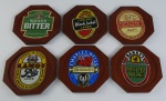 6 porta copos oitavados confeccionado em madeira decorado com rótulos de cerveja. Medidas aproximadas 10 x10 cm