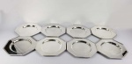 WOLFF - OITO SOUSPLATS EM METAL ESPESSURADO A PRATA. FEITIO OCTAGONAL. 20 CM DE DIAMETRO.