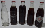 5 garrafas historicas da Coca Cola