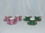 Seis (6) xícaras e pires para café em porcelana rosa e verde, moldadas em retorcido, pires em forma de folha, aplicados com douração. Uma com marca do Windsor.