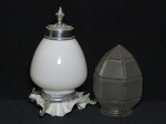 Duas (2) cúpulas para lustre: a) Em vidro leitoso, borda em babado, detalhes aplicados em metal prateado. Alt. 28cm. b) Em vidro fosco, moldagem facetada. Alt. 19cm.
