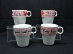 PORCELANA - Conjunto de 4 xícaras em porcelana e suporte em metal cromado.
